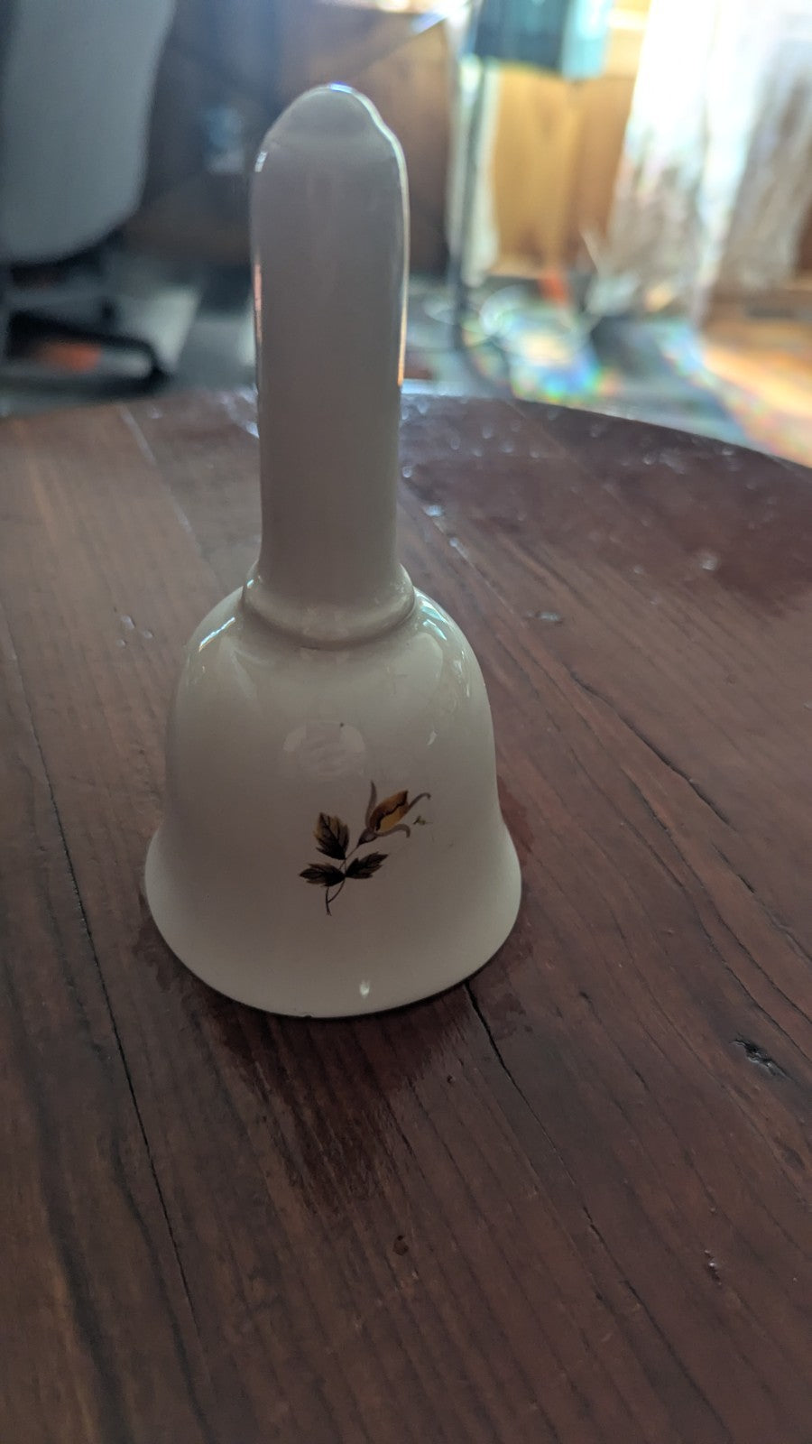 white Vintage Bell with Orange Roses | Crystal Arborist