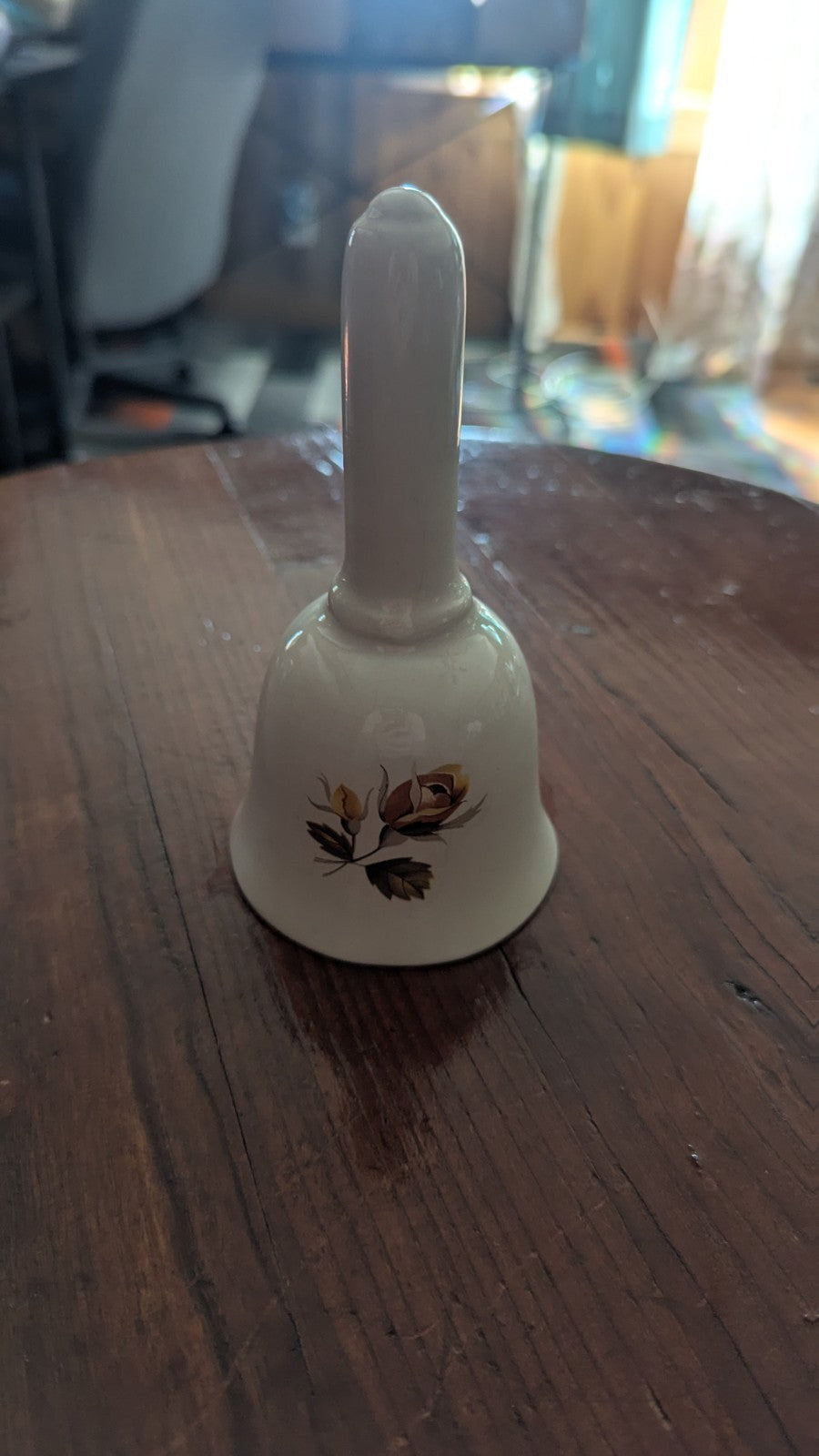 white Vintage Bell with Orange Roses | Crystal Arborist