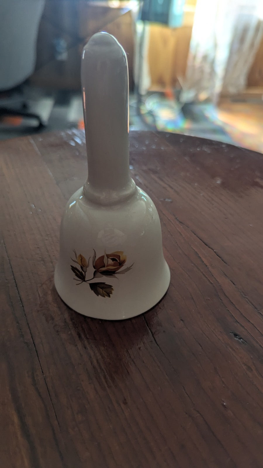 white Vintage Bell with Orange Roses | Crystal Arborist